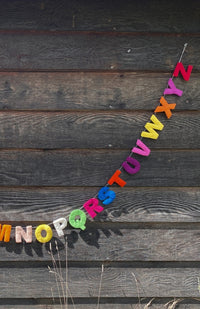Colorful felt alphabet garland, handmade in Nepal.