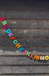 Colorful felt alphabet garland, handmade in Nepal.