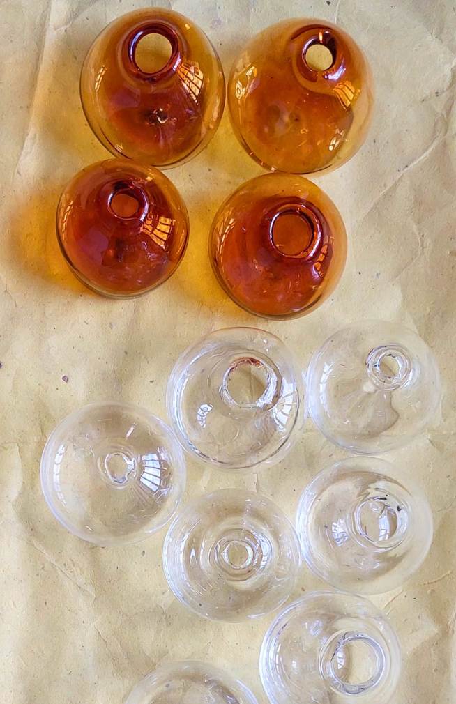 Small teardrop shaped glass bud vase. Handmade in Nepal. Fair trade.