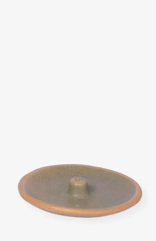 green glazed circular ceramic incense holder