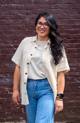 Oversized short sleeve cream cotton shirt with front coconut buttons, breast pocket and collar