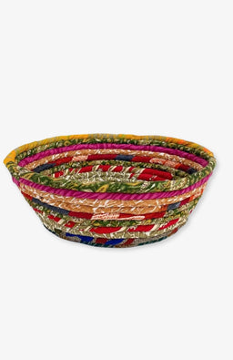 Recycled silk sari scraps are wrapped around cotton rope to create these one-of a kind coiled bowls. Handmade in Nepal.