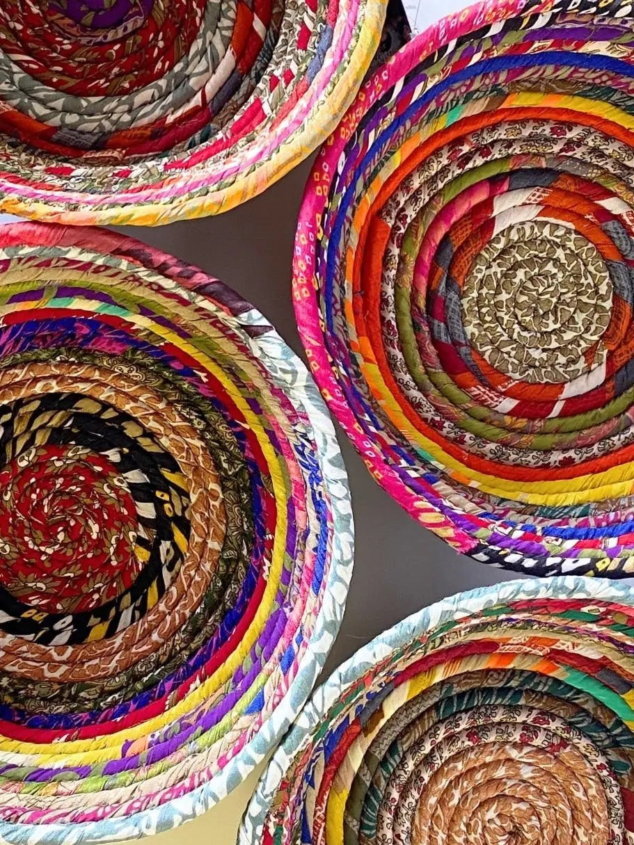 Recycled silk sari scraps are wrapped around cotton rope to create these one-of a kind coiled bowls. Handmade in Nepal.