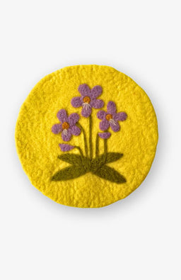 Yellow felt trivet with purple violet, February flower of the month