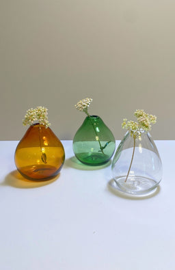 Small teardrop shaped glass bud vase in amber, clear and green. Handmade in Nepal.