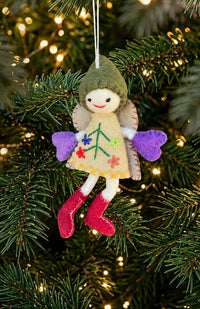 Handmade felted wool fairy with wings ornament wearing a dress, hat, and boots. Fair trade and handmade in Nepal.