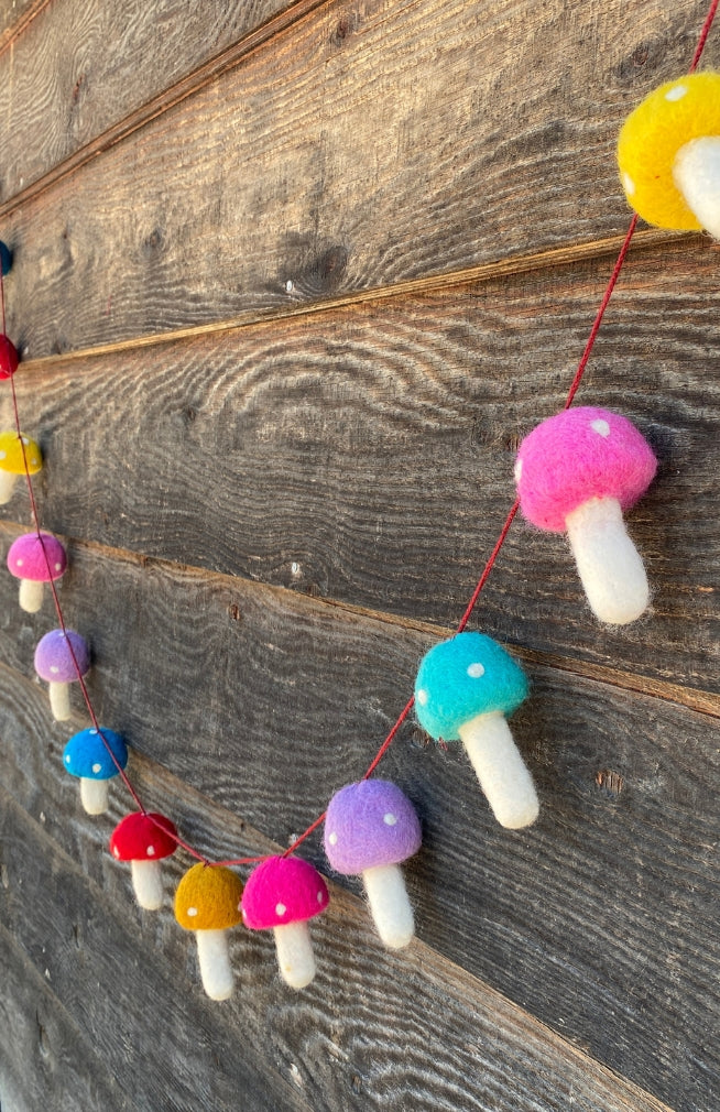 Handmade colorful felt mushroom garland. Fair trade Nepal.