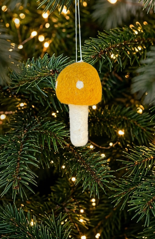 Handmade felt mushroom ornament in assorted colors. Fair Trade and Handmade in Nepal with 100% New Zealand wool.