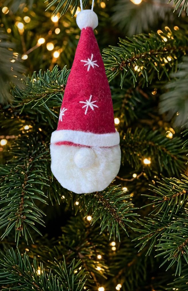 Handmade felt Santa head ornament with red stocking cap and beard. Fair trade Nepal.