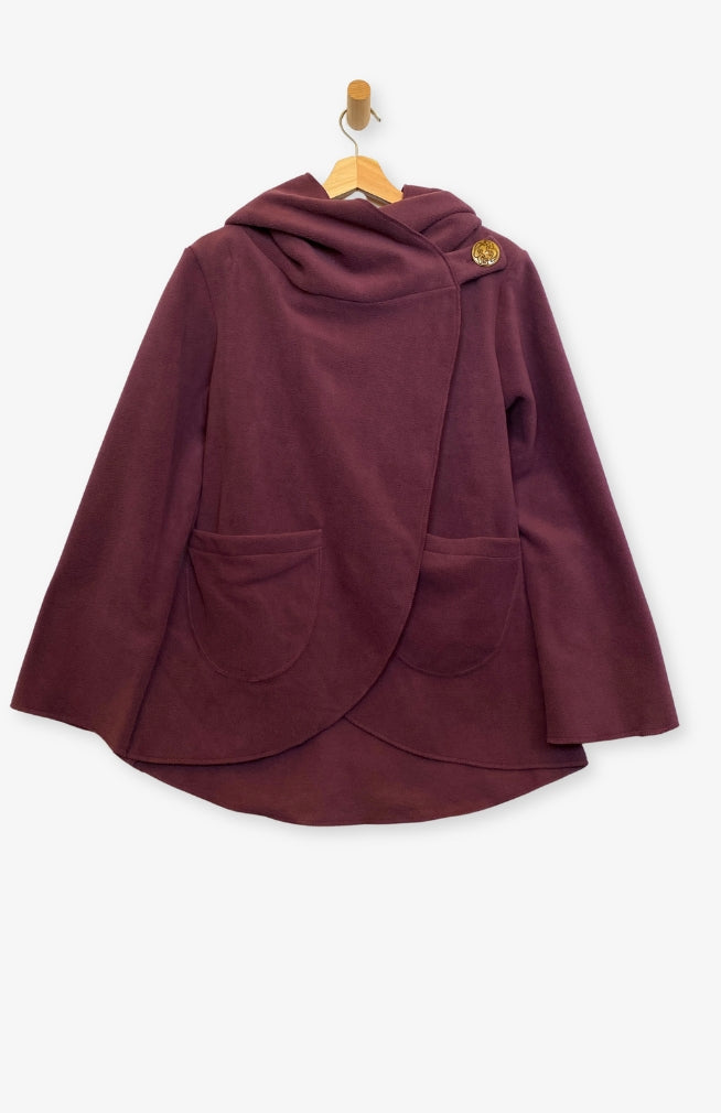 Handcrafted fleece wrap around jacket with pockets and hood in burgundy. Fair Trade, Made by artisans in Nepal.