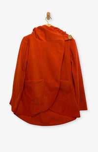 Handcrafted fleece wrap around jacket with pockets and hood in orange. Fair Trade, Made by artisans in Nepal.