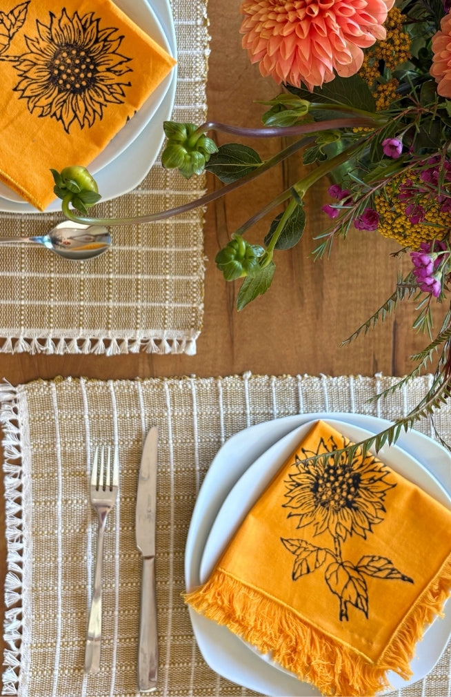Handmade sunflower print napkin with fringed edges. Fair trade and handmade in Nepal.