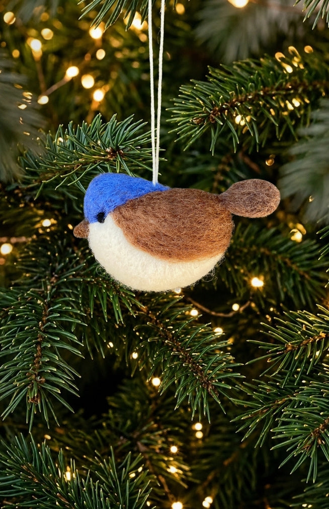 Hand Felted Bird Ornament with blue head, brown back, and white body. Fair trade Nepal.