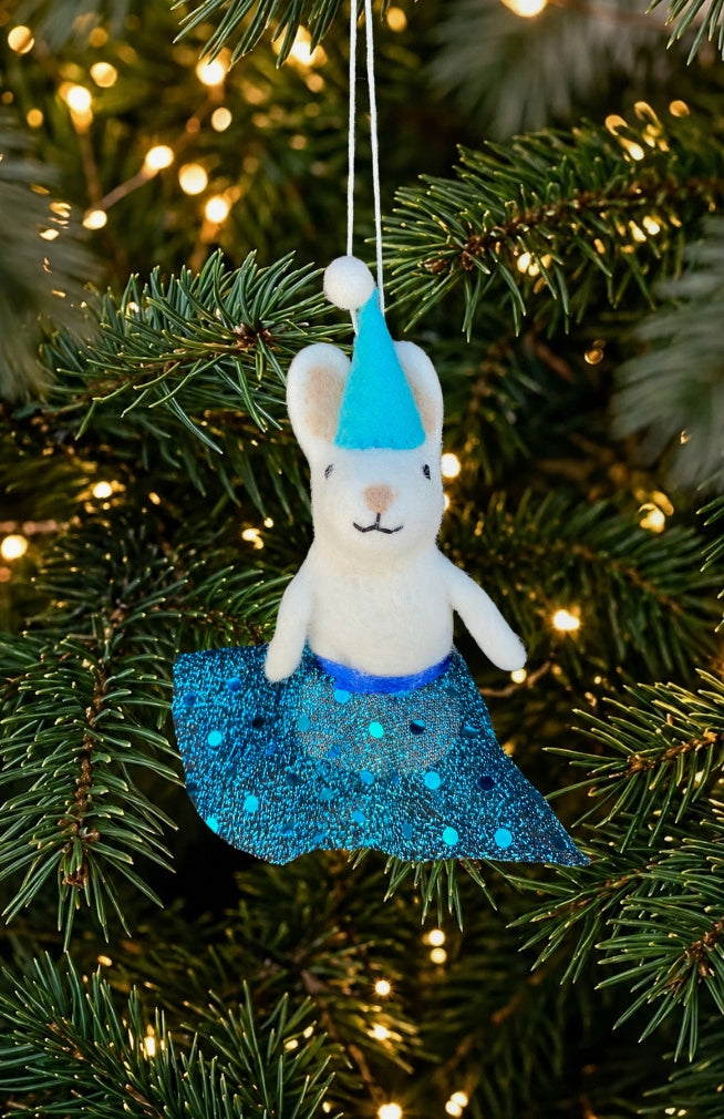 A dancing white bunny ornament and finger puppet with sparkly skirt and blue Santa hat. Fair trade and handmade in Nepal.