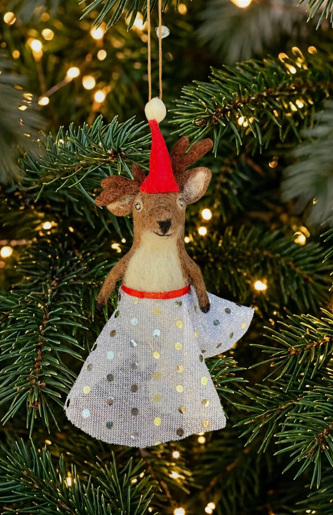 A dancing deer ornament and finger puppet with sparkly skirt and Santa hat. Fair trade and handmade in Nepal.