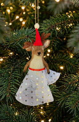 A dancing deer ornament and finger puppet with sparkly skirt and Santa hat. Fair trade and handmade in Nepal.
