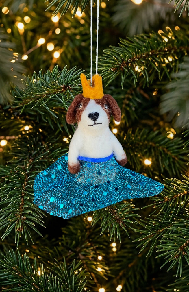 A dancing dog ornament and finger puppet with sparkly skirt and crown. Fair trade and handmade in Nepal.