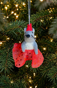 A dancing mouse ornament and finger puppet with sparkly skirt and crown. Fair trade and handmade in Nepal.