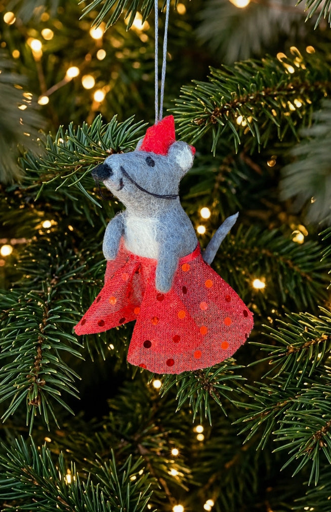 A dancing mouse ornament and finger puppet with sparkly skirt and crown. Fair trade and handmade in Nepal.