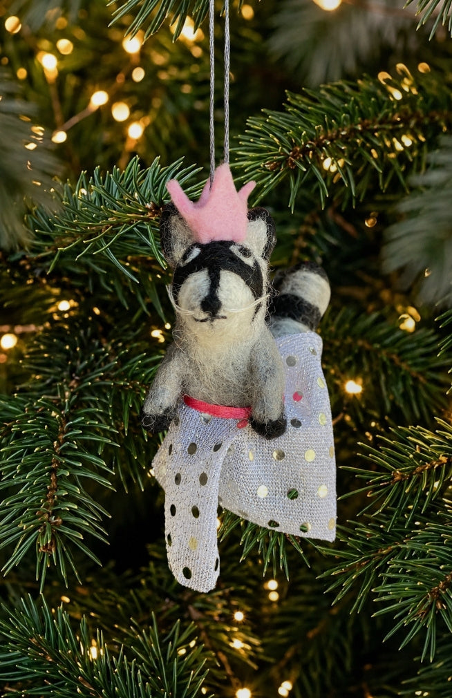 A dancing raccoon ornament and finger puppet with sparkly skirt and pink crown. Fair trade and handmade in Nepal.