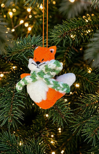 Hand felted orange fox ornament with green and white striped scarf. Handmade in Nepal. Fair trade. 