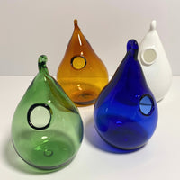 Handblown glass hanging bud vases in tear drop shape with loop for hanging in amber, green, white, and blue. 