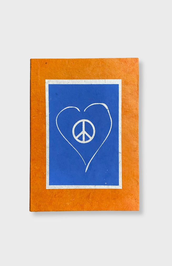 Handcrafted Lokta Paper Large Journal with love and peace design. These journals are handmade by artisans in Nepal and come in assorted vibrant colors.