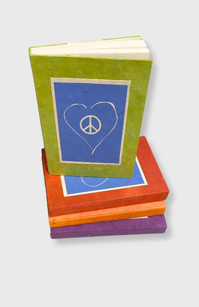 Handcrafted Lokta Paper Large Journal with love and peace design. These journals are handmade by artisans in Nepal and come in assorted vibrant colors.