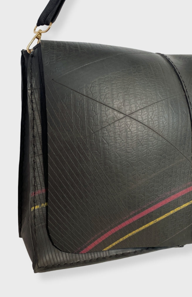 Recycled tire rubber messenger bag with removable strap. Fair trade, handmade in Nepal.