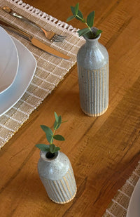 Small and large stoneware ceramic bud vase with stripes, handcrafted by artisans in Nepal.