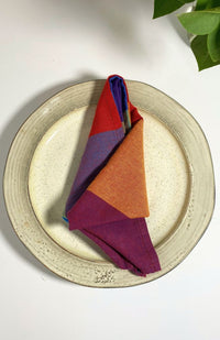 A rainbow/multicolor checked cloth napkin sold as a set of two, quick drying,  handmade in Nepal. 