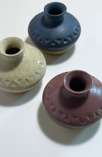 Small handmade ceramic bud vase, handmade in Nepal with a triangle design, available in an assortment of colors.