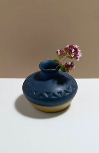 Small handmade ceramic bud vase, handmade in Nepal with a triangle design, available in an assortment of colors.