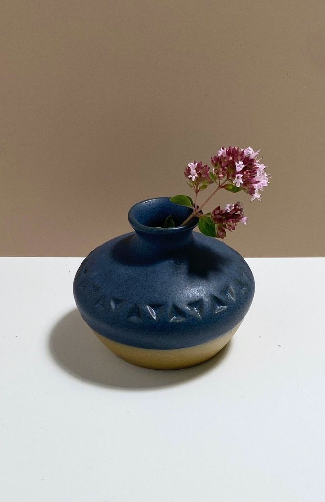 Small handmade ceramic bud vase, handmade in Nepal with a triangle design, available in an assortment of colors.