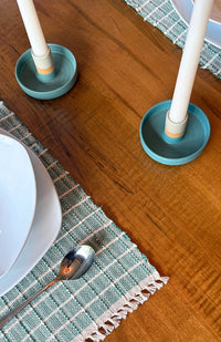 Handmade ceramic candle holder with stripes. Made by artisans in Nepal. Available in an assortment of colors. Fair Trade.