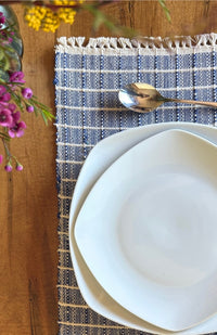 Handwoven ribbed cotton placemat with subtle square design available in assorted colors. Handmade in Nepal.