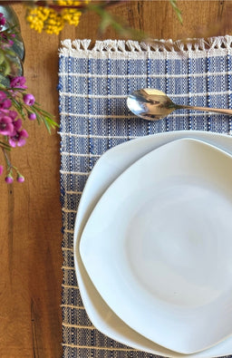 Handwoven ribbed cotton placemat with subtle square design available in assorted colors. Handmade in Nepal.