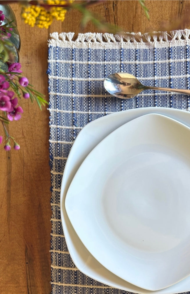 Handwoven ribbed cotton placemat with subtle square design available in assorted colors. Handmade in Nepal.
