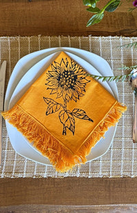 Handmade sunflower print napkin with fringed edges. Fair trade and handmade in Nepal.