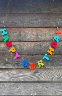 A colorful 'HAPPY BIRTHDAY' felt letter garland. Fair trade and handmade in Nepal.