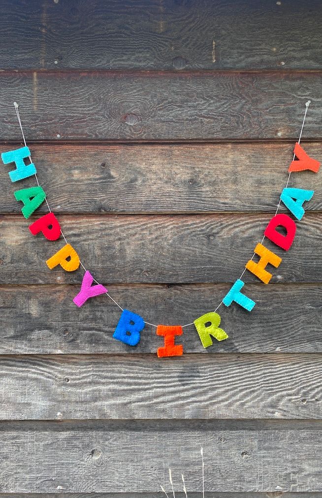 A colorful 'HAPPY BIRTHDAY' felt letter garland. Fair trade and handmade in Nepal.