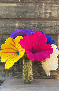 large handmade felt wool flowers in assorted bright colors. Fair trade Nepal