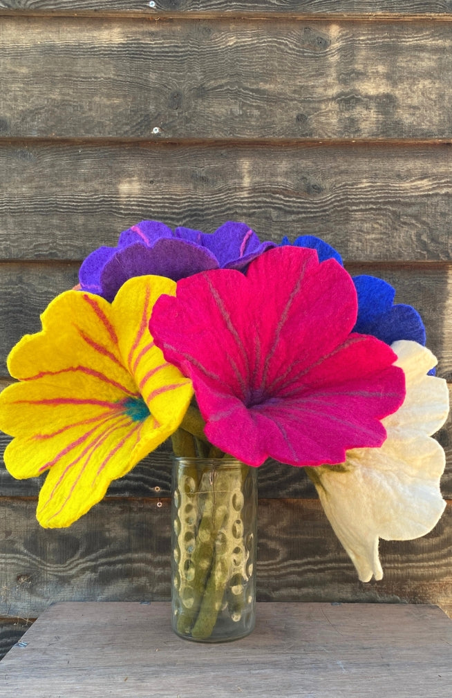 large handmade felt wool flowers in assorted bright colors. Fair trade Nepal