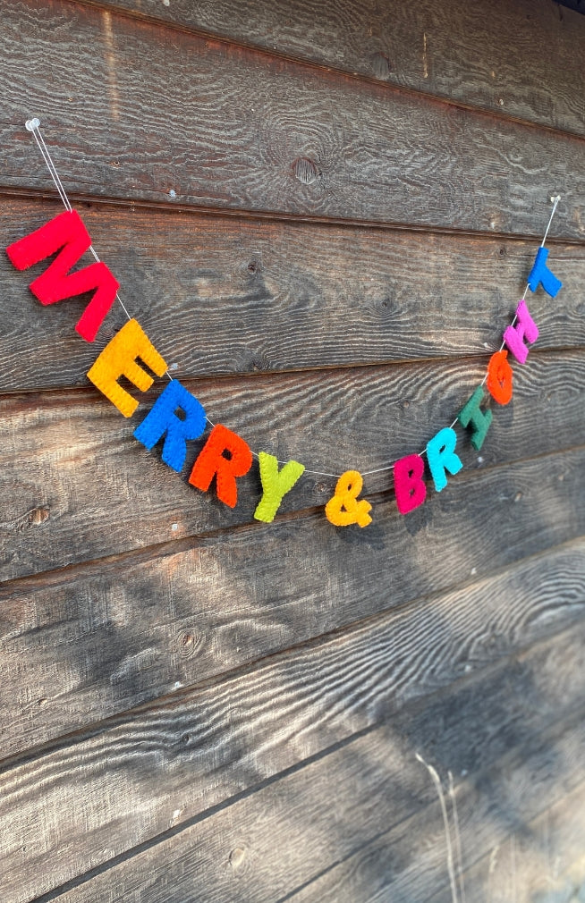 Colorful hand crafted "MERRY & BRIGHT" garland on white string with loops for hanging
