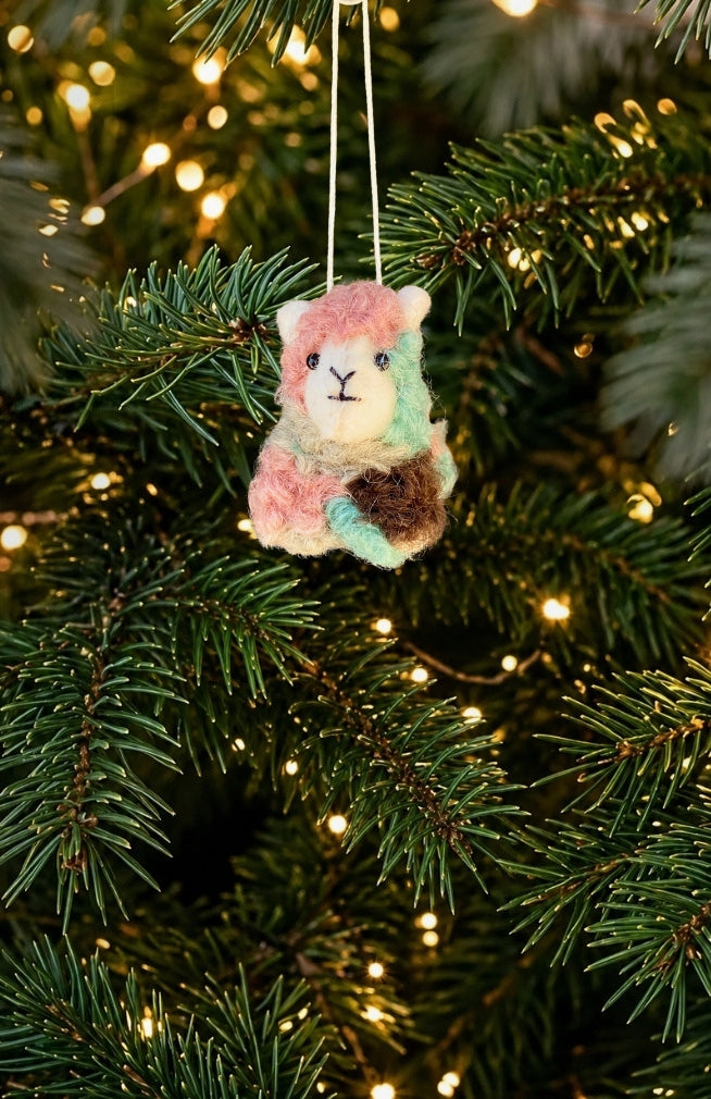 A set of 6 colorful felt sheep ornaments. Handmade in Nepal from 100% New Zealand wool. Fair trade.