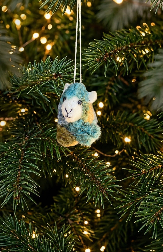 A set of 6 colorful felt sheep ornaments. Handmade in Nepal from 100% New Zealand wool. Fair trade.