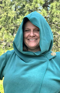 Handcrafted fleece wrap around jacket with pockets and hood. Fair trade Nepal.