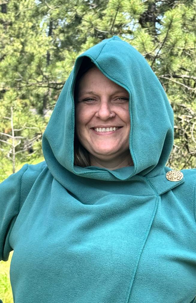 Handcrafted fleece wrap around jacket with pockets and hood. Fair trade Nepal.