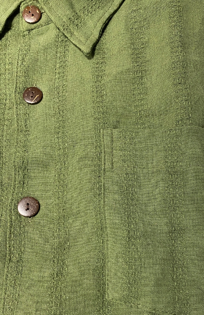 Oversized short sleeve green cotton shirt with front coconut buttons, breast pocket and collar. Handmade by artisans in Nepal.