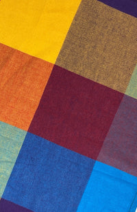 Close up image of rainbow/multicolor checked cloth napkin sold as a set of two, quick drying,  handmade in Nepal. 